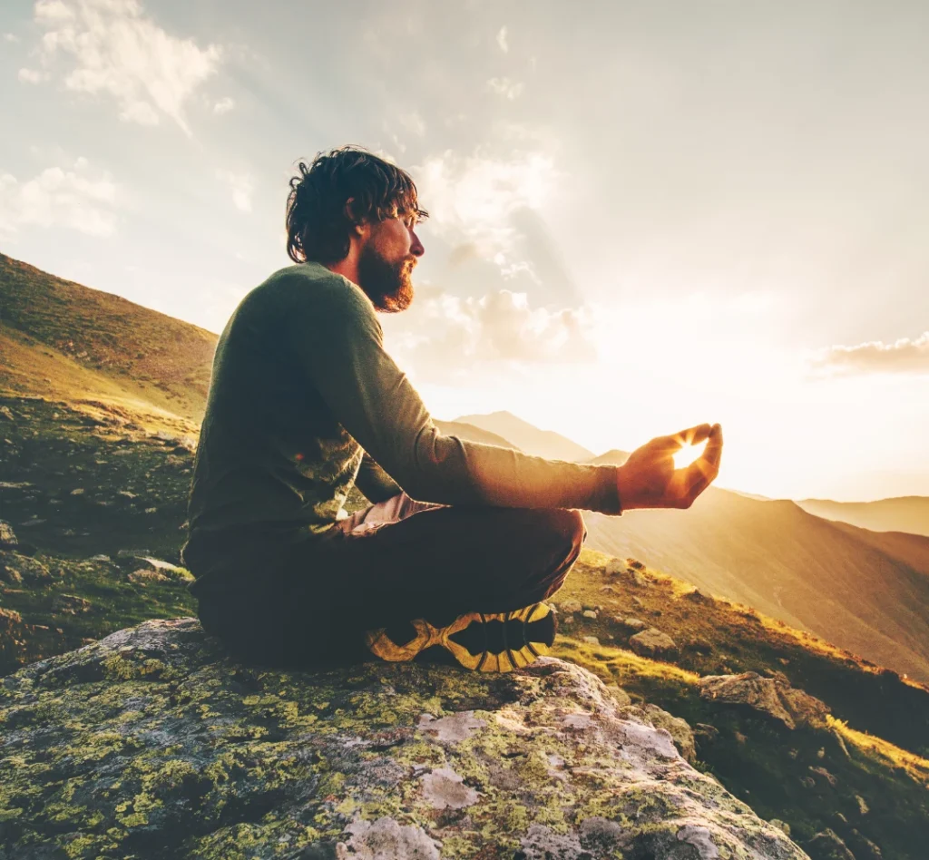 Not Sure Where to Start - Man meditating on a mountain top